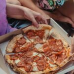 Why pizza boxes are square but pizzas are round?